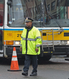 11/11/2015-Boston,MA. Boston police Captain Haseeb Hosein is seen working at a construction detail on Columbia Rd. Wednesday afternoon, 35 minutes after he helped subdue a distraught, hatchet-wielding man on an MBTA bus. Ed note, bus in background is not the bus involved in incident. Boston Police media relations officer Jamie Kenneally identified Hosein on scene. Staff photo by Mark Garfinkel