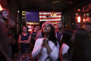TOPSHOT - Sri Vasamsetti, 22, of Seattle and a supporter of Democratic presidential candidate Hillary Clinton, watches televised coverage of the US presidential election at the Comet Tavern in the Capitol Hill neighborhood of Seattle, Washington on November 8, 2016.  / AFP / Jason Redmond        (Photo credit should read JASON REDMOND/AFP/Getty Images)
